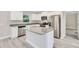 Stylish kitchen with stainless steel appliances, granite countertops, and a central island at 211 Oak Lane Cir, Ocala, FL 34472