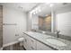 Bathroom featuring a double vanity with granite counters and tiled shower at 217 Oak Lane Cir, Ocala, FL 34472