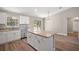 Bright kitchen with stainless appliances, granite countertops, and sliding door to yard at 217 Oak Lane Cir, Ocala, FL 34472