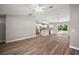 Inviting living room with a light interior, hardwood flooring, open layout, and a bright atmosphere at 217 Oak Lane Cir, Ocala, FL 34472