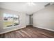 Bright living area with large window and door and wood floors next to a front door at 217 Oak Lane Cir, Ocala, FL 34472