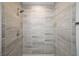 Modern shower tiled with gray stone at 217 Oak Lane Cir, Ocala, FL 34472