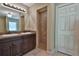 Bathroom featuring double vanity, a tiled shower stall, and a linen closet at 23458 Nw Amberjack Ave, Dunnellon, FL 34431