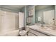 Clean bathroom with modern fixtures, white tile, and a stylish marble countertop vanity at 2426 Sw 168Th Loop, Ocala, FL 34473