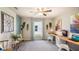 Bright home office with custom desk, modern decor, and plenty of natural light at 2426 Sw 168Th Loop, Ocala, FL 34473