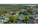Expansive aerial view of a neighborhood showcasing lush greenery and well-maintained homes at 3010 Sw 137Th Pl, Ocala, FL 34473