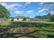 Spacious backyard featuring a large grassy area and a privacy fence at 3010 Sw 137Th Pl, Ocala, FL 34473