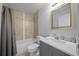 Bathroom featuring a shower-tub combination with tile surround, vanity with mirror, and tile floors at 3010 Sw 137Th Pl, Ocala, FL 34473