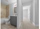 Bathroom featuring a shower-tub combination with tile surround, vanity, and tile floors at 3010 Sw 137Th Pl, Ocala, FL 34473