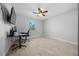 Spacious bedroom features tile floors, ceiling fan, and a window with a view at 3010 Sw 137Th Pl, Ocala, FL 34473