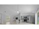 The kitchen features stainless steel appliances, tiled floors and an island at 3010 Sw 137Th Pl, Ocala, FL 34473