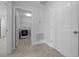 Laundry room view includes an open doorway and tile floors at 3010 Sw 137Th Pl, Ocala, FL 34473