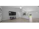 Spacious living area features tiled floors, a ceiling fan, and ample natural light at 3010 Sw 137Th Pl, Ocala, FL 34473