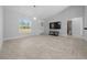 Inviting living room with vaulted ceilings, tiled floors, and contemporary fixtures at 3010 Sw 137Th Pl, Ocala, FL 34473