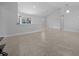 Open-concept living room with tiled floors, recessed lighting, and vaulted ceilings at 3010 Sw 137Th Pl, Ocala, FL 34473