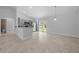 Combined kitchen and living space featuring stainless steel appliances and sliding glass doors at 3010 Sw 137Th Pl, Ocala, FL 34473