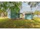 View of the side of the house with the shed and basketball hoop at 307 Nw 10Th Ave, Ocala, FL 34475