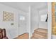 Bright entryway features a front door with decorative glass, tiled floor, and staircase to the upper level at 307 Nw 10Th Ave, Ocala, FL 34475