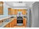 Well-equipped kitchen with wood cabinets, stainless steel appliances, and ample counter space at 307 Nw 10Th Ave, Ocala, FL 34475