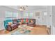 Bright living room with a leather sectional, ceiling fan, and colorful decor at 307 Nw 10Th Ave, Ocala, FL 34475