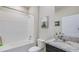This bathroom features a shower and bathtub combination and a granite countertop sink at 3990 Nw 48Th Terrace Rd, Ocala, FL 34482