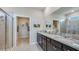 Elegant bathroom featuring dual sinks, a walk-in shower, and plenty of storage space at 3990 Nw 48Th Terrace Rd, Ocala, FL 34482