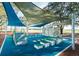 Colorful playground with climbing and play structures, covered by shade canopies at 3990 Nw 48Th Terrace Rd, Ocala, FL 34482
