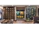 Restaurant featuring dark wood and stone accents with a dining table and wine display at 3990 Nw 48Th Terrace Rd, Ocala, FL 34482