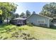 Landscaped backyard with large in-ground pool and screened enclosure at 4245 Se 24Th Ter, Ocala, FL 34480