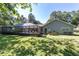 Sprawling backyard with a large in-ground pool and surrounding screened enclosure at 4245 Se 24Th Ter, Ocala, FL 34480
