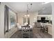 Bright dining area featuring white table and chairs with natural light and easy access to the kitchen and outdoor area at 4245 Se 24Th Ter, Ocala, FL 34480