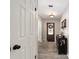 Warm and inviting entryway with wood-look tile flooring and a decorative front door at 4245 Se 24Th Ter, Ocala, FL 34480