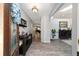 Inviting entryway with wood-look tile flooring and stylish console table at 4245 Se 24Th Ter, Ocala, FL 34480