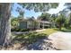 Well-maintained single-story home with a lush front lawn and mature shade trees at 4245 Se 24Th Ter, Ocala, FL 34480