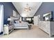 Spacious main bedroom with vaulted ceilings, ceiling fans, and coordinated furniture set at 4245 Se 24Th Ter, Ocala, FL 34480