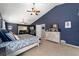 Main bedroom featuring vaulted ceilings, ceiling fans, and coordinated furniture set at 4245 Se 24Th Ter, Ocala, FL 34480