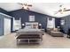 Serene main bedroom with vaulted ceilings, comfortable bed, and ample natural light at 4245 Se 24Th Ter, Ocala, FL 34480