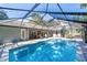 In-ground swimming pool featuring a screened enclosure with access to the house at 4245 Se 24Th Ter, Ocala, FL 34480