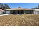 Charming one-story home featuring a well-maintained lawn and attached garage at 43 Pine Radl, Ocala, FL 34472