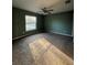 Large bedroom with a window and neutral colored carpet at 43 Pine Radl, Ocala, FL 34472