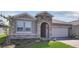 Charming single-Gathering home featuring a stone-accented entrance and a well-maintained front lawn at 4546 Nw 53Rd Avenue Rd, Ocala, FL 34482
