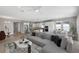 Bright living area offering an open concept layout with a kitchen, dining area, and stylish decor at 4546 Nw 53Rd Avenue Rd, Ocala, FL 34482