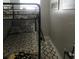 Small bedroom with bunk beds and light colored rug at 509 Del Mar Dr, Lady Lake, FL 32159