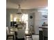 Well lit dining room with chandelier and glass table at 509 Del Mar Dr, Lady Lake, FL 32159