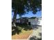 Well-maintained home featuring a two-car garage and manicured lawn at 509 Del Mar Dr, Lady Lake, FL 32159