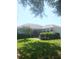 Charming single-story home with a well-manicured lawn and mature landscaping, providing a welcoming curb appeal at 509 Del Mar Dr, Lady Lake, FL 32159