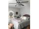 Comfortable main bedroom boasts a decorative ceiling fan, accent pillows, and a plush duvet at 509 Del Mar Dr, Lady Lake, FL 32159