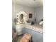 Cozy main bedroom features a white dresser with vanity mirror and accent chair at 509 Del Mar Dr, Lady Lake, FL 32159