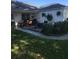 Charming patio area with comfortable seating and hanging plants at 509 Del Mar Dr, Lady Lake, FL 32159