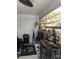 Bright sunroom with tile flooring, hanging plants, decorative accents, and lots of natural light at 509 Del Mar Dr, Lady Lake, FL 32159